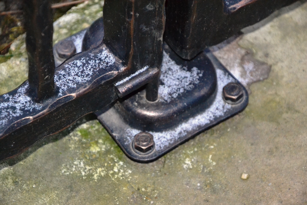 Using a bottom stop for a swing gate